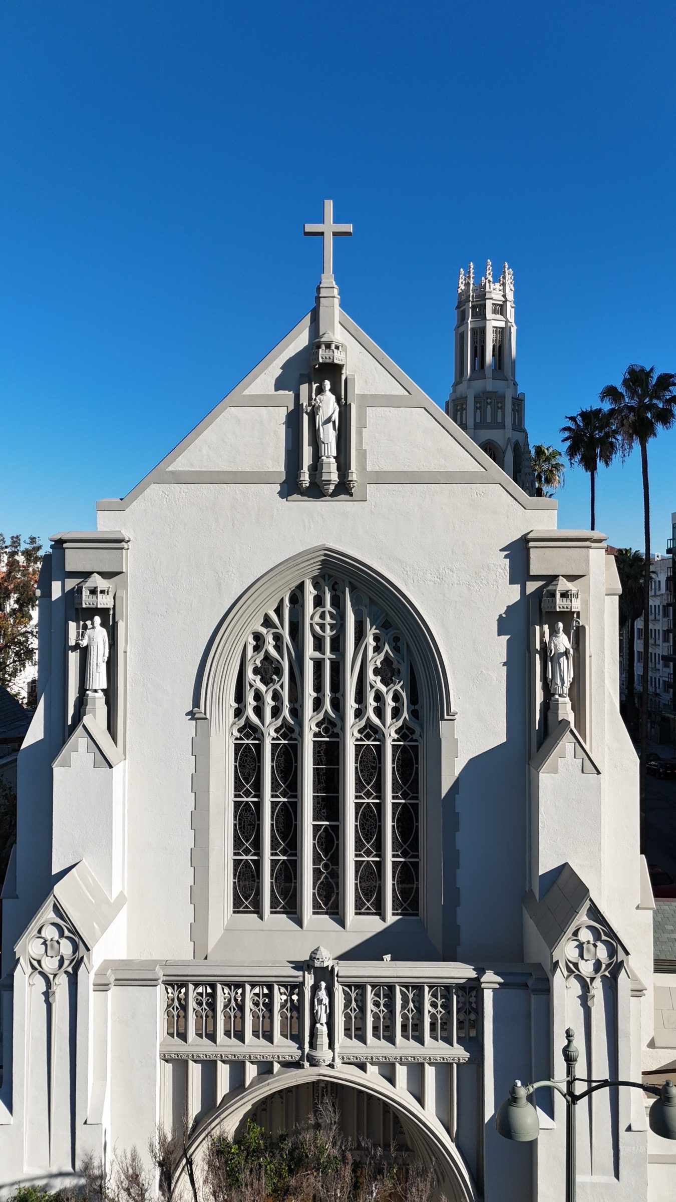 Exterior of St. James’ in-the-City beneath a blue Los Angeles sky.